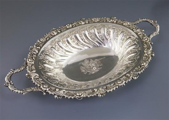 A good George III Sheffield plate two-handled embossed oval fruit bowl, with rose and gadrooned border, crested, 49.7cm